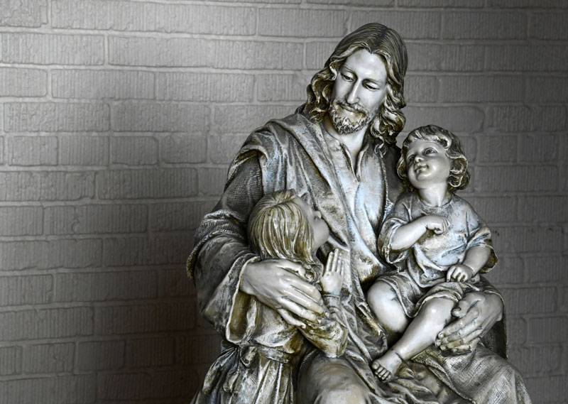 Statue of Jesus with children.