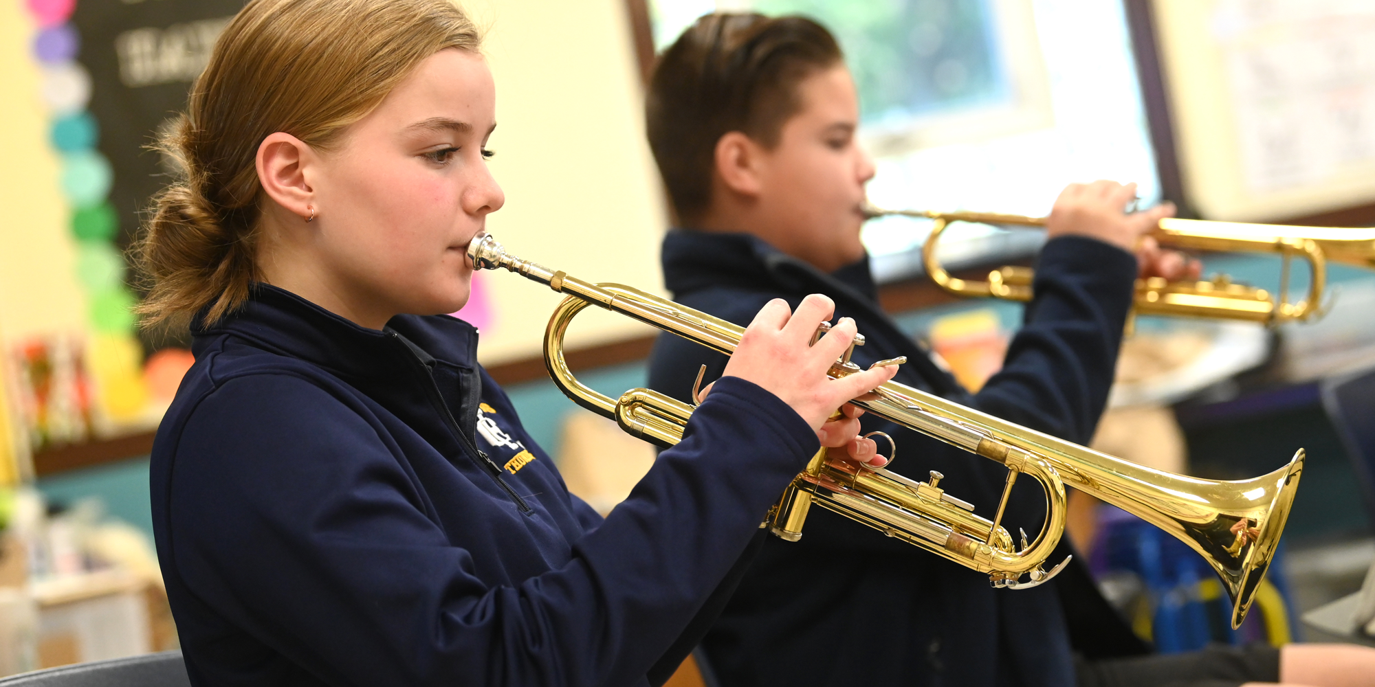Band students practice horn at Holy Cross School which is located near the Red Smith neighborhood.