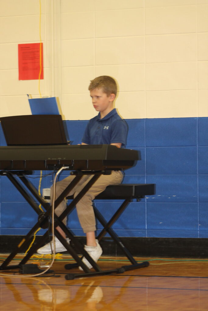 Flynn Logan, 3rd grader playing Sword Dance on the piano