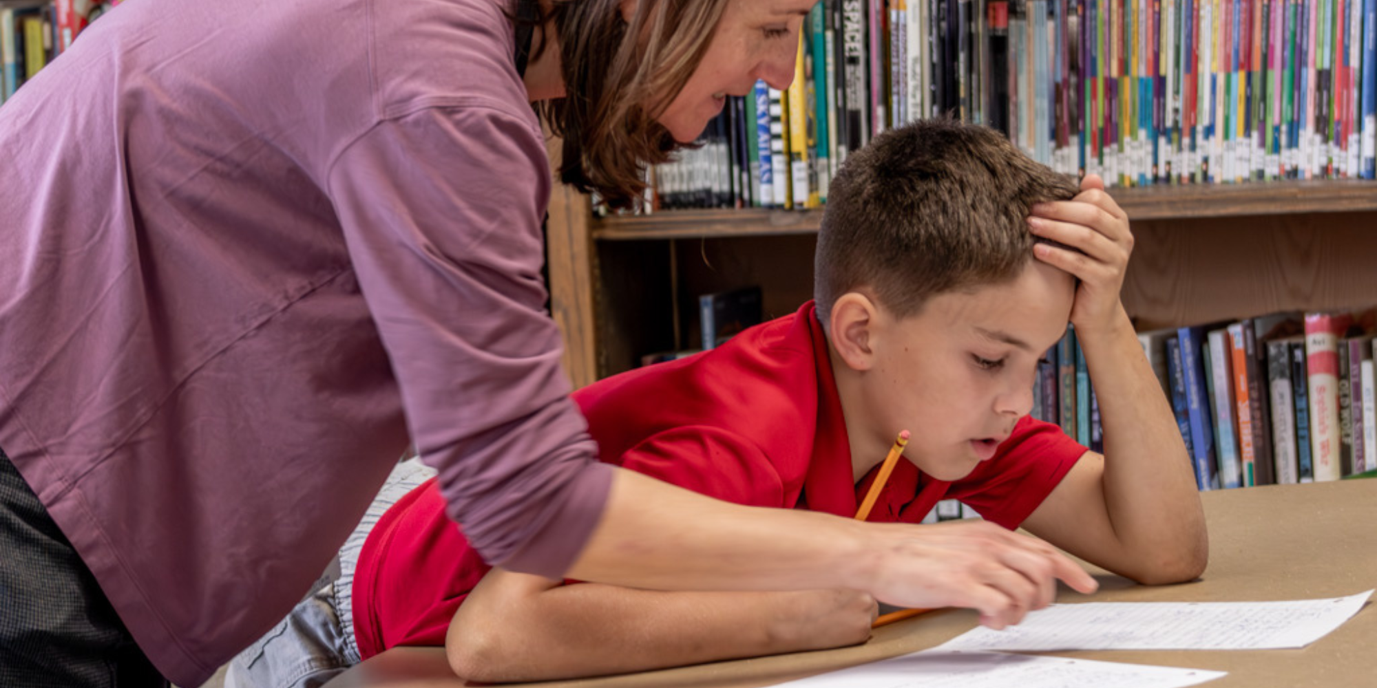 GRACE teacher discussing assignment with student